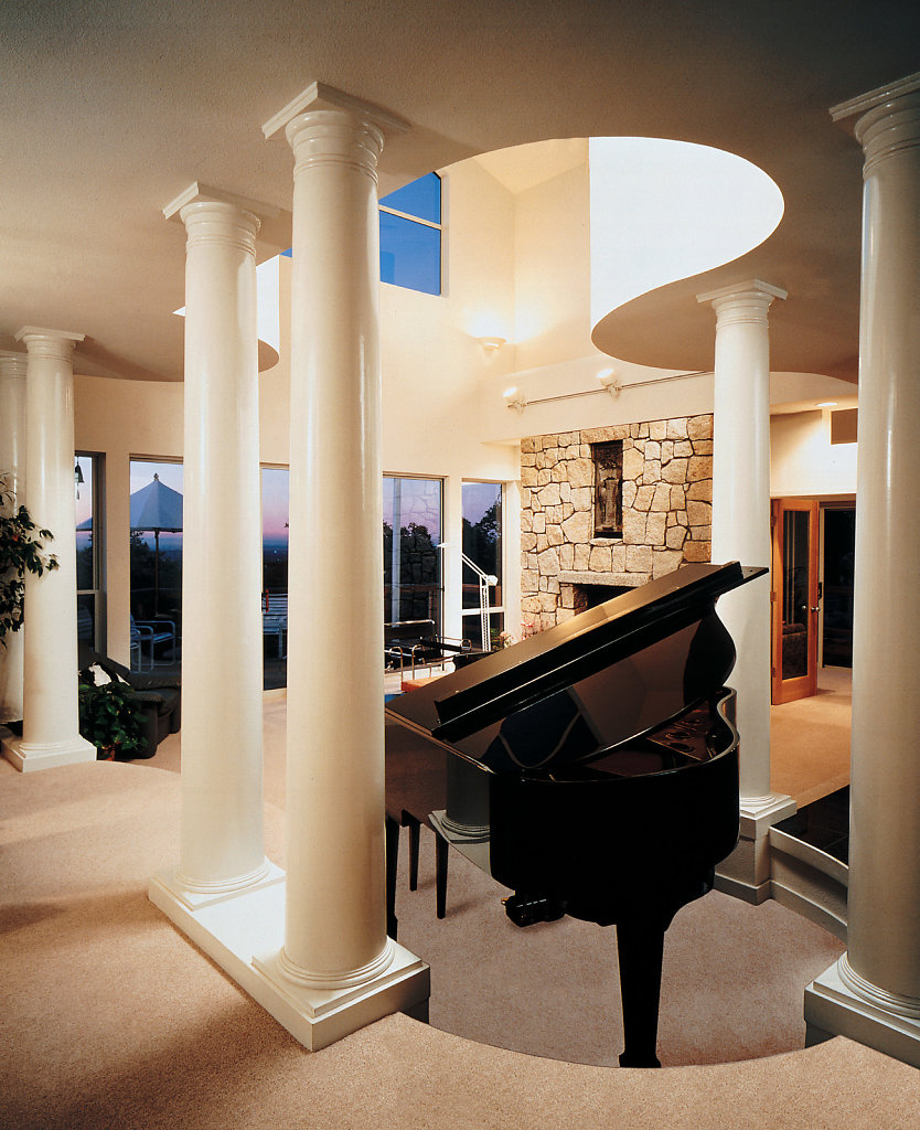 Tuscan Columns around a Piano in a Living Room