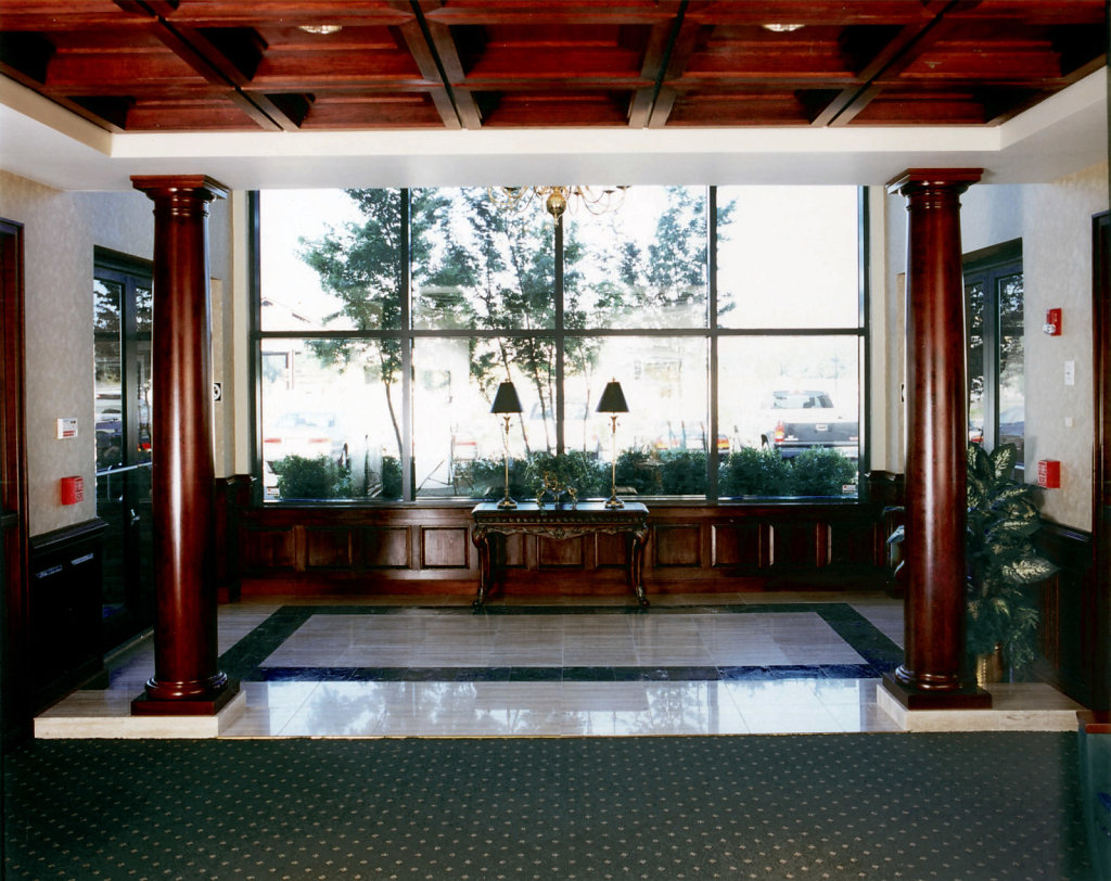 Stained Smooth Wood Columns in Breezeway