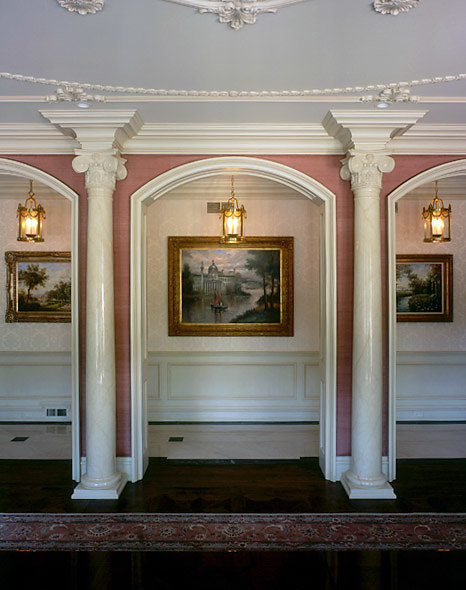 Angular Ionic Capitals on Two Wood Columns