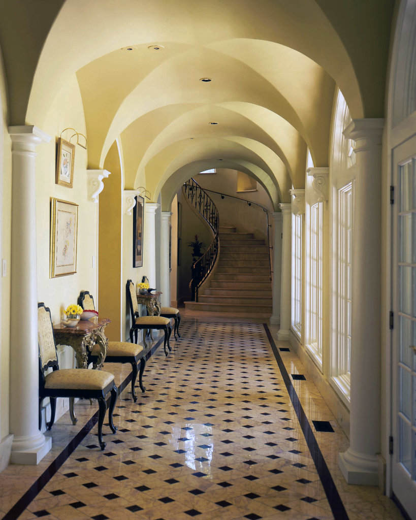 PolyStone® Pilasters Line a Hallway